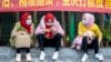 CHINA -- Uyghur minority people wait at the Guangzhou main railway station wearing protective masks for protection of Covid-19 in Guangzhou, February 12, 2020