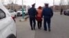 Kazakhstan - Police officers are detaining Akhzhan Nogayeva who has performed in front of the city administration building. 1 April 2020